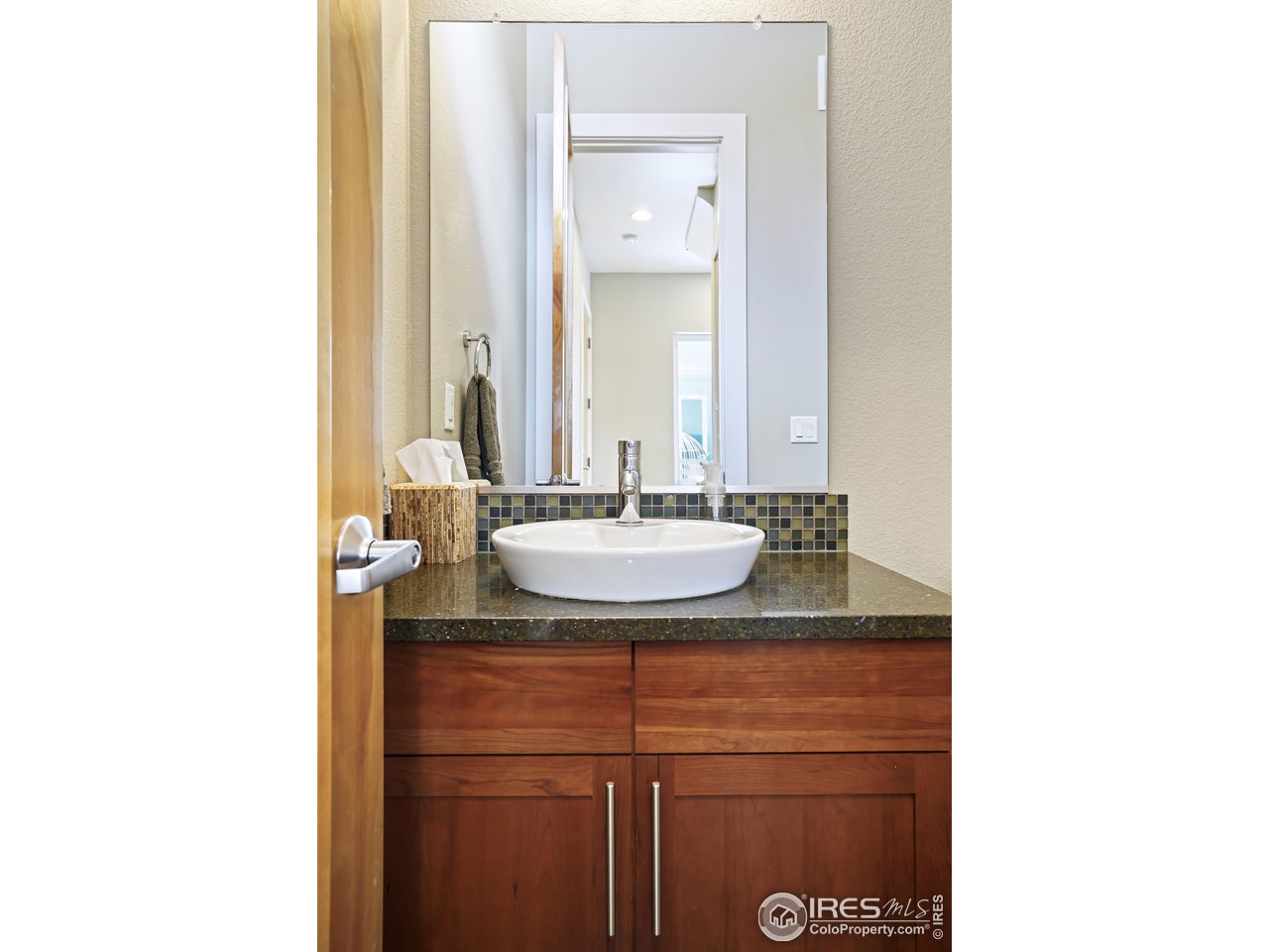 5263 Denver Street Boulder, CO 80304 - Photo 15 of 40 a bathroom with a sink and a mirror