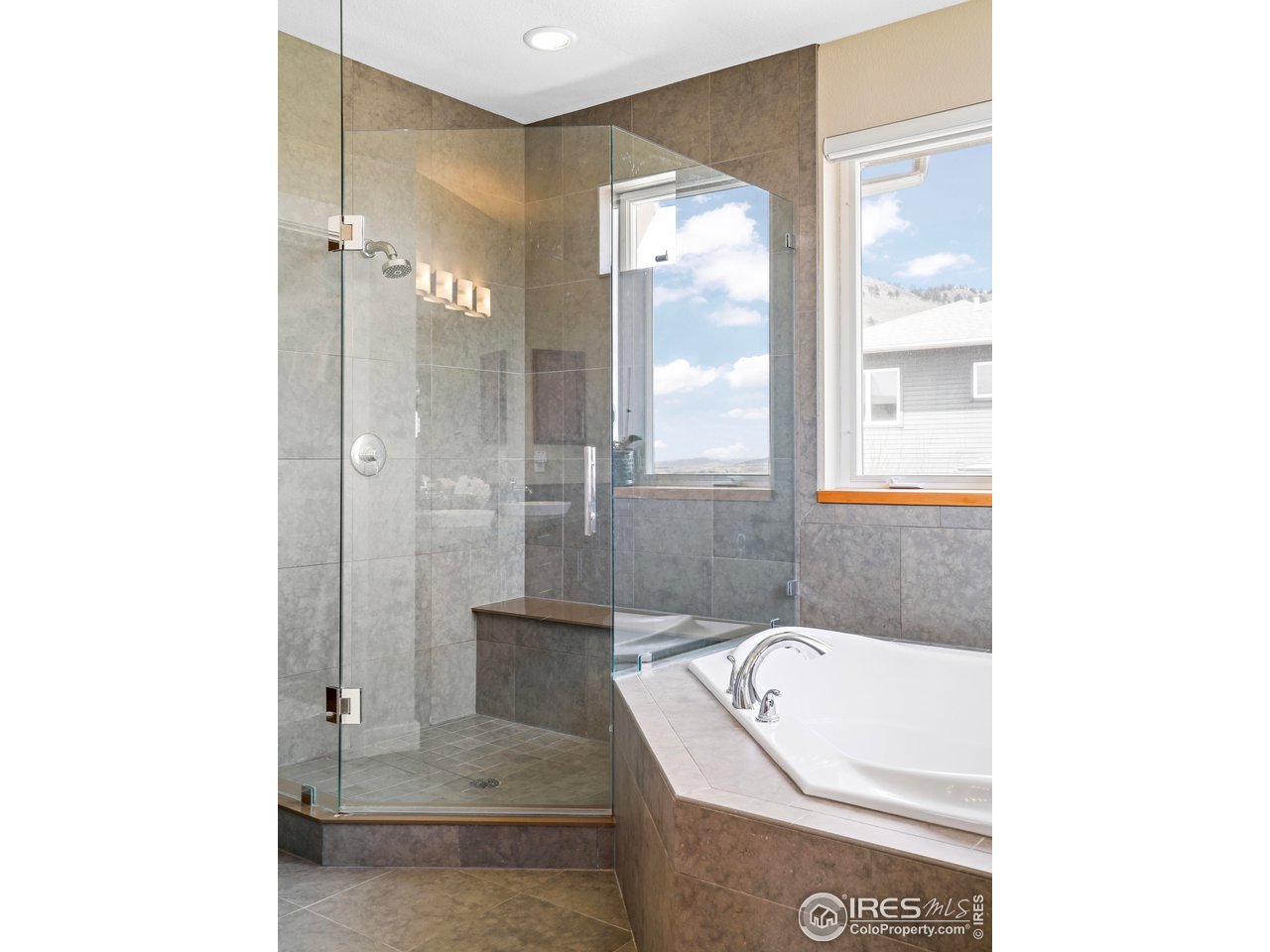 5263 Denver Street Boulder, CO 80304 - Photo 20 of 40 a bathroom with a bathtub and a shower