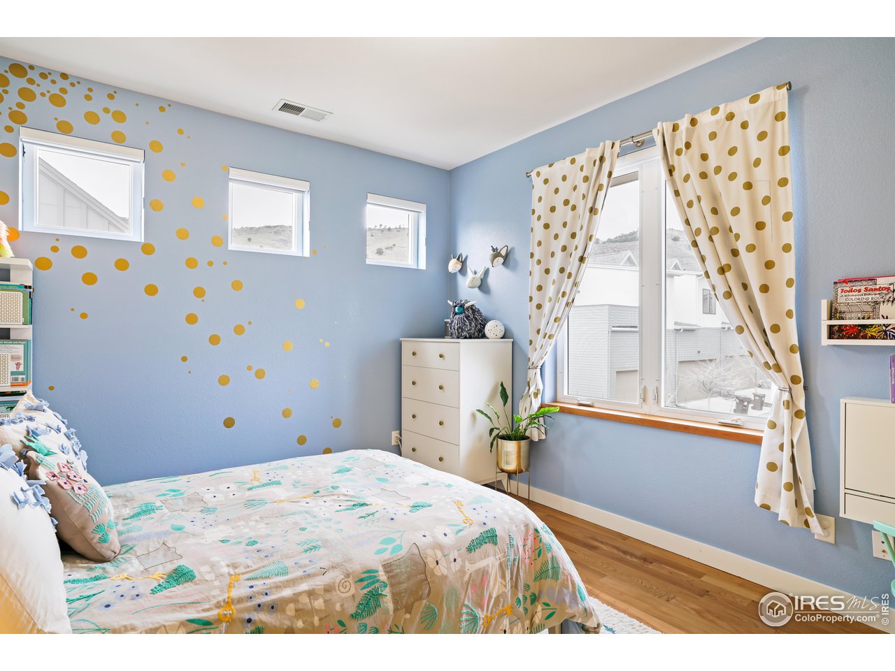5263 Denver Street Boulder, CO 80304 - Photo 22 of 40 a bedroom with a bed and a window