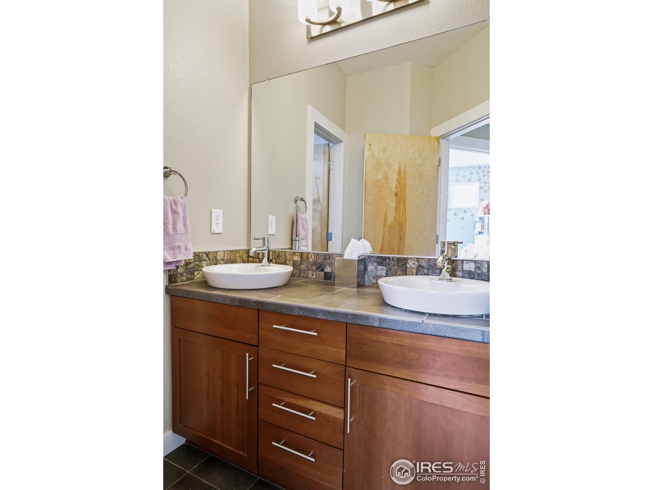 5263 Denver Street Boulder, CO 80304 - Photo 24 of 40 a bathroom with a sink and a mirror