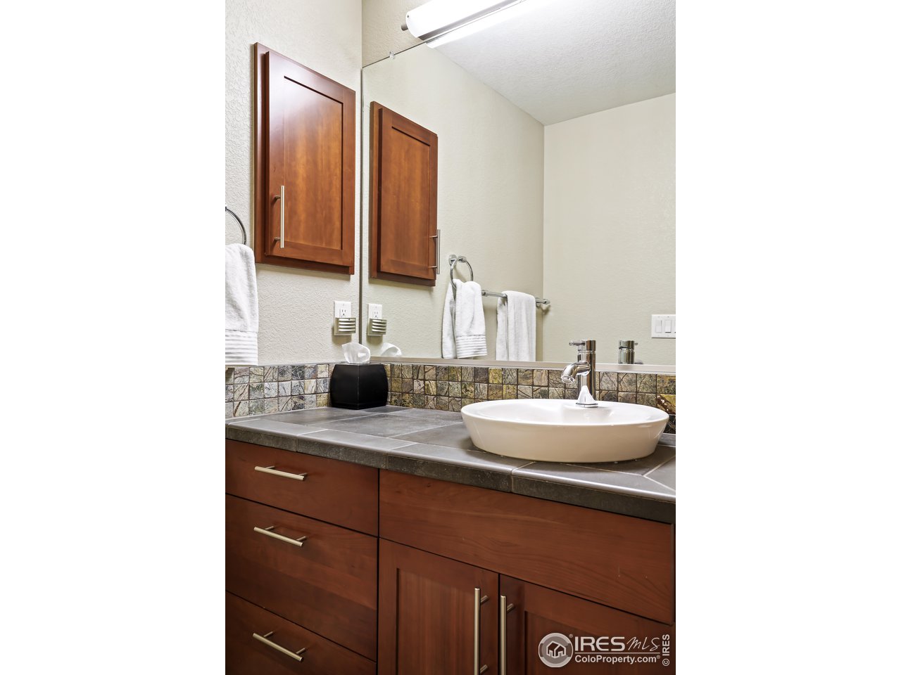 5263 Denver Street Boulder, CO 80304 - Photo 29 of 40 a bathroom with a sink and a mirror