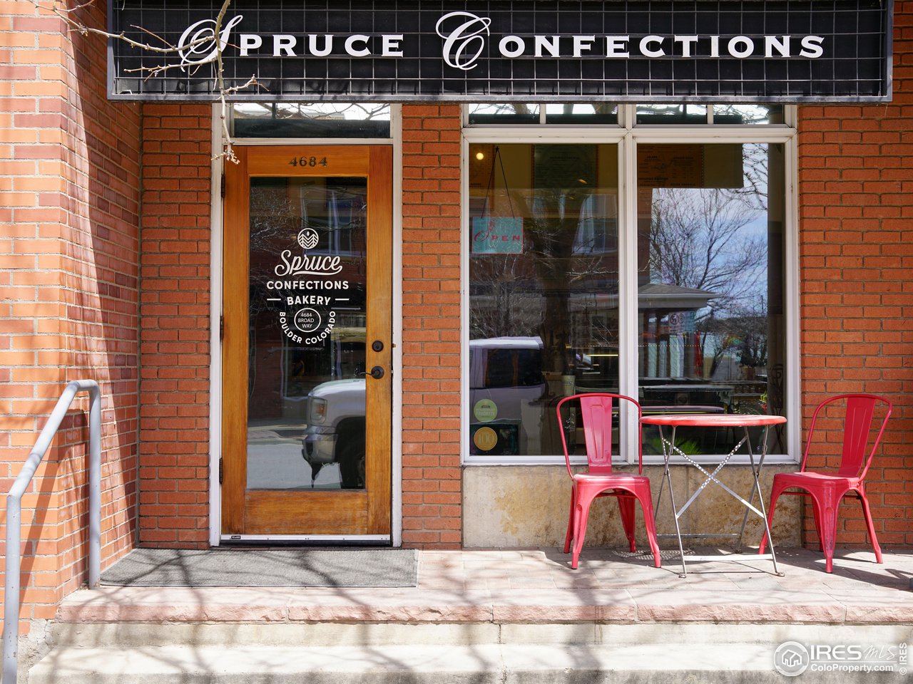 5263 Denver Street Boulder, CO 80304 - Photo 36 of 40 a view of a brick building with a bench in front of building