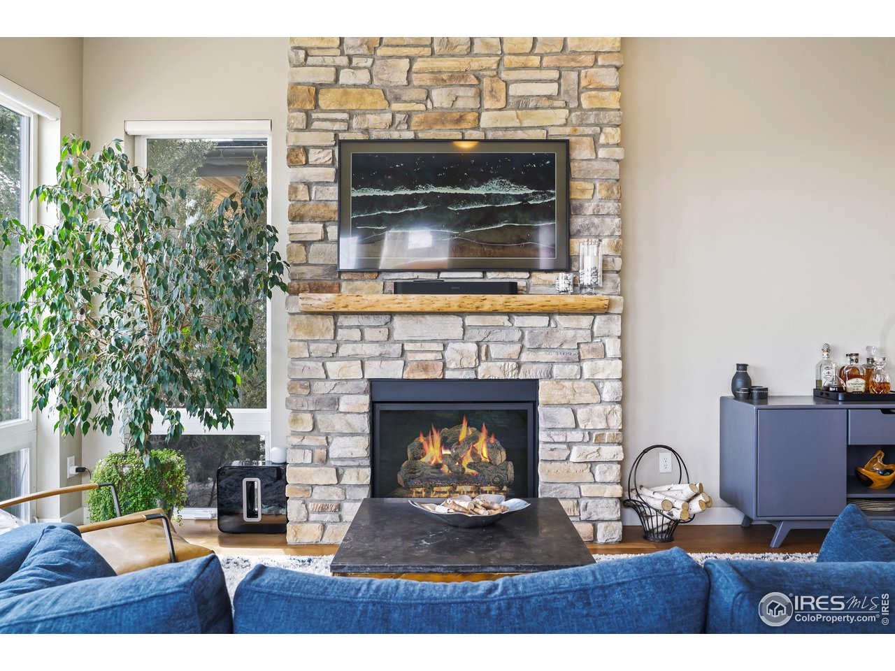 5263 Denver Street Boulder, CO 80304 - Photo 8 of 40 a living room with furniture and a fireplace
