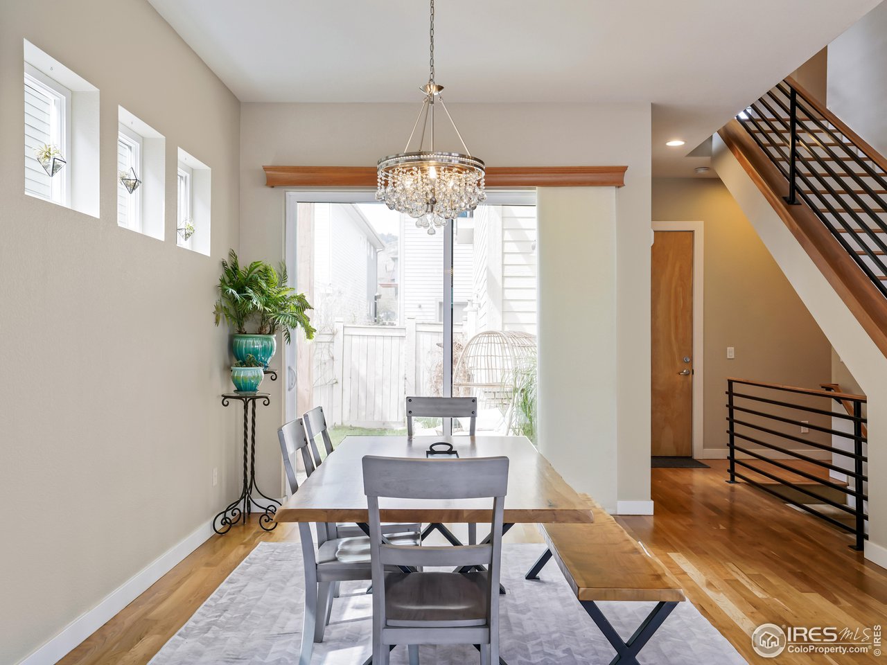 5263 Denver Street Boulder, CO 80304 - Photo 10 of 40 a view of a dining room with furniture window and wooden floor