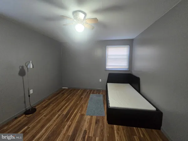 a room with a bed and a window