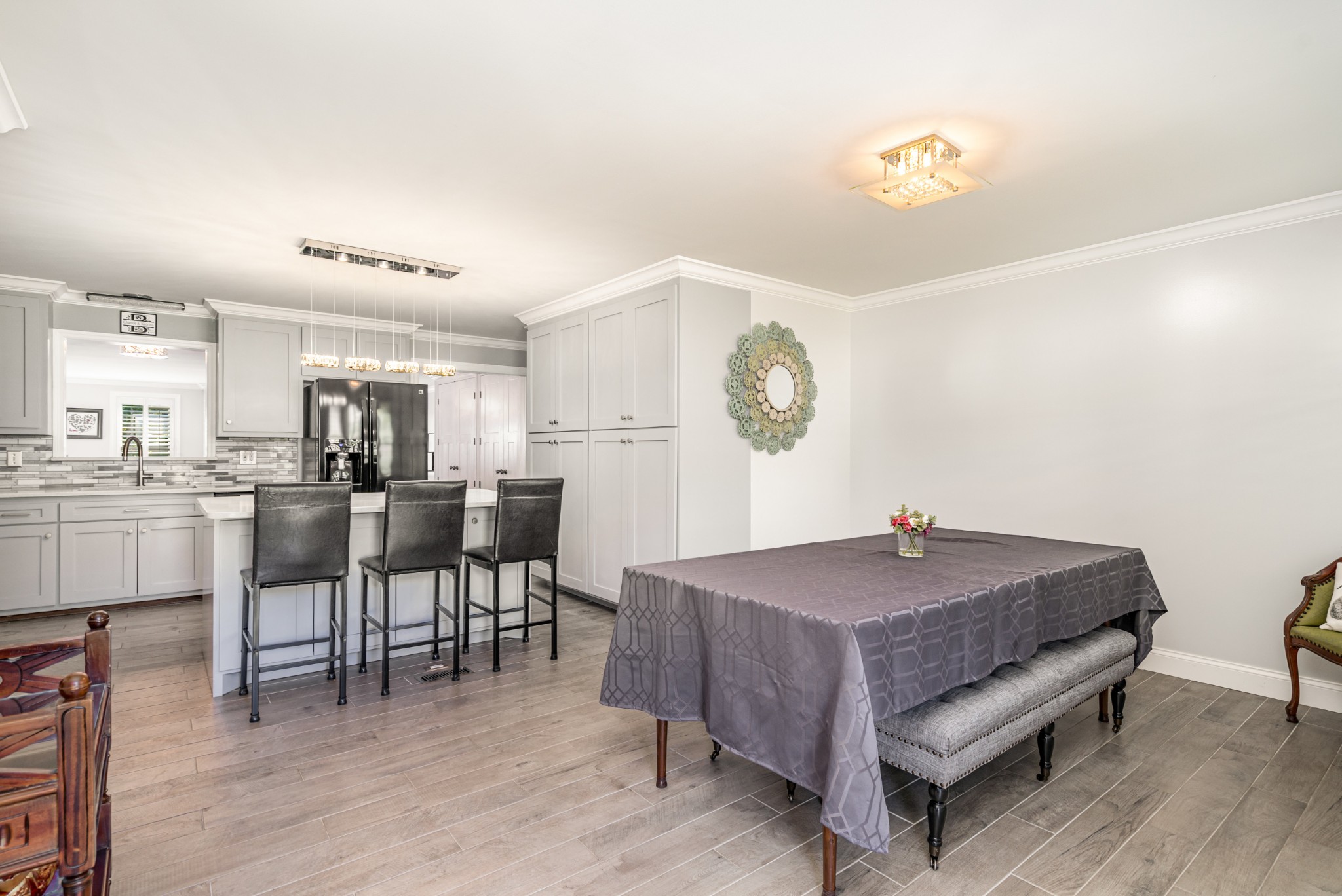 240 Green Harbor Road Old Hickory, TN 37138 - Photo 12 of 30 a living room with furniture a kitchen island a sink and a stove with wooden floor