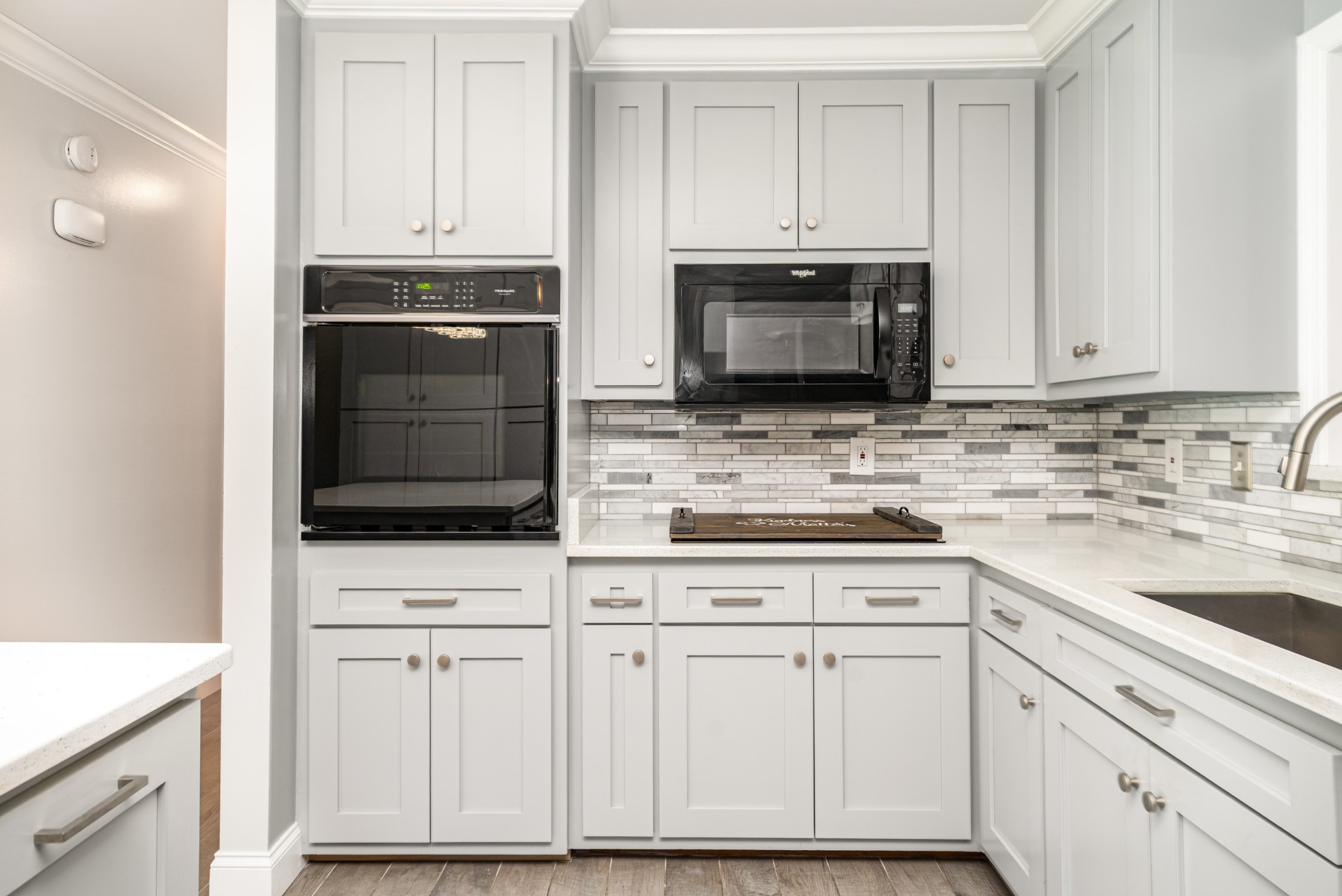 240 Green Harbor Road Old Hickory, TN 37138 - Photo 15 of 30 a kitchen with white cabinets and stainless steel appliances