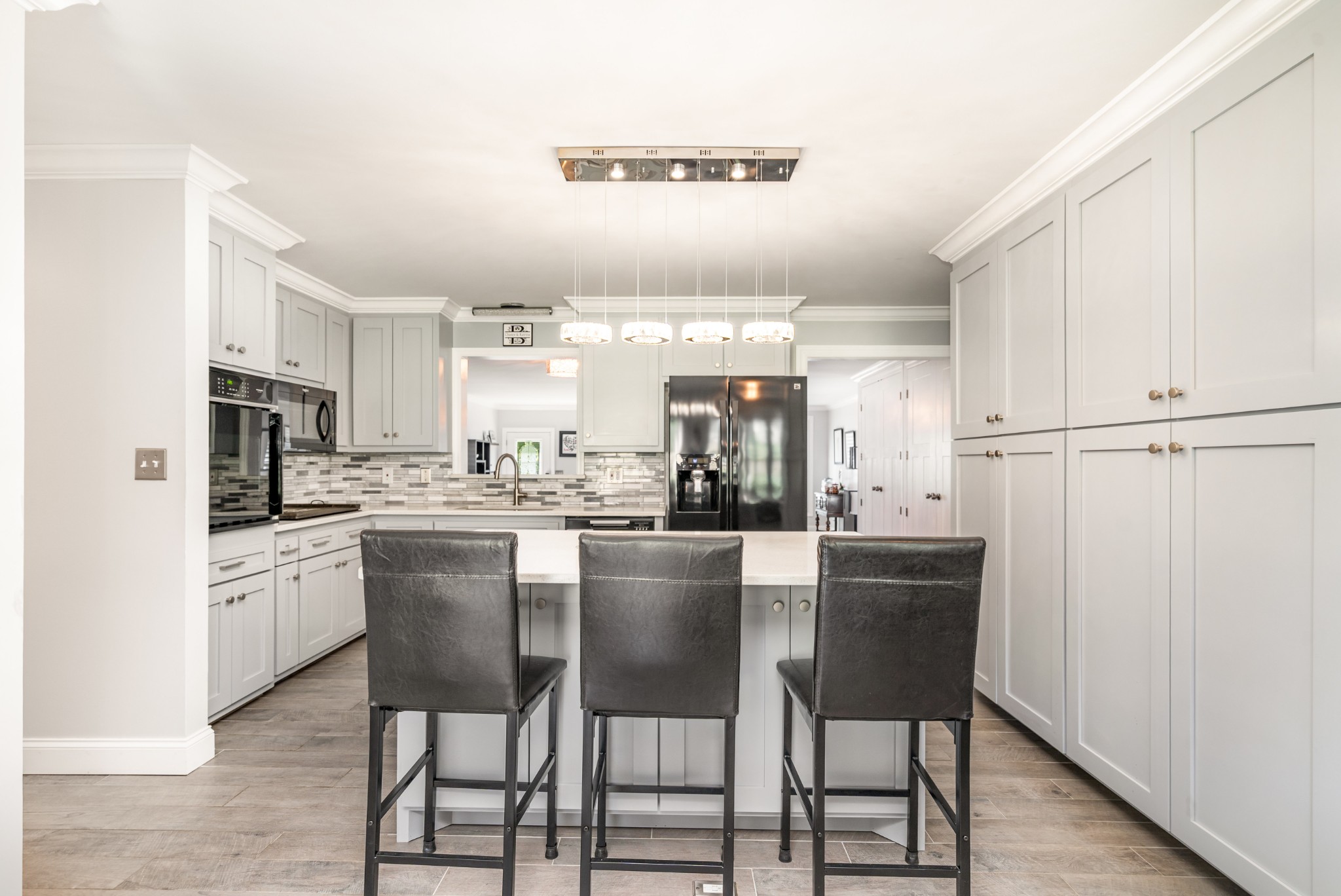 240 Green Harbor Road Old Hickory, TN 37138 - Photo 16 of 30 a kitchen with stainless steel appliances kitchen island granite countertop a table chairs microwave and sink