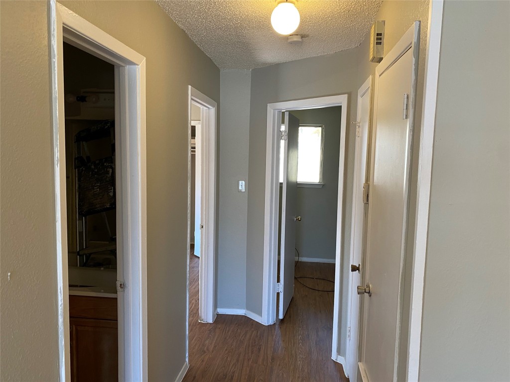 5202 Bogey Court, Unit A Austin, TX 78744 - Photo 3 of 15 a view of a hallway with wooden floor