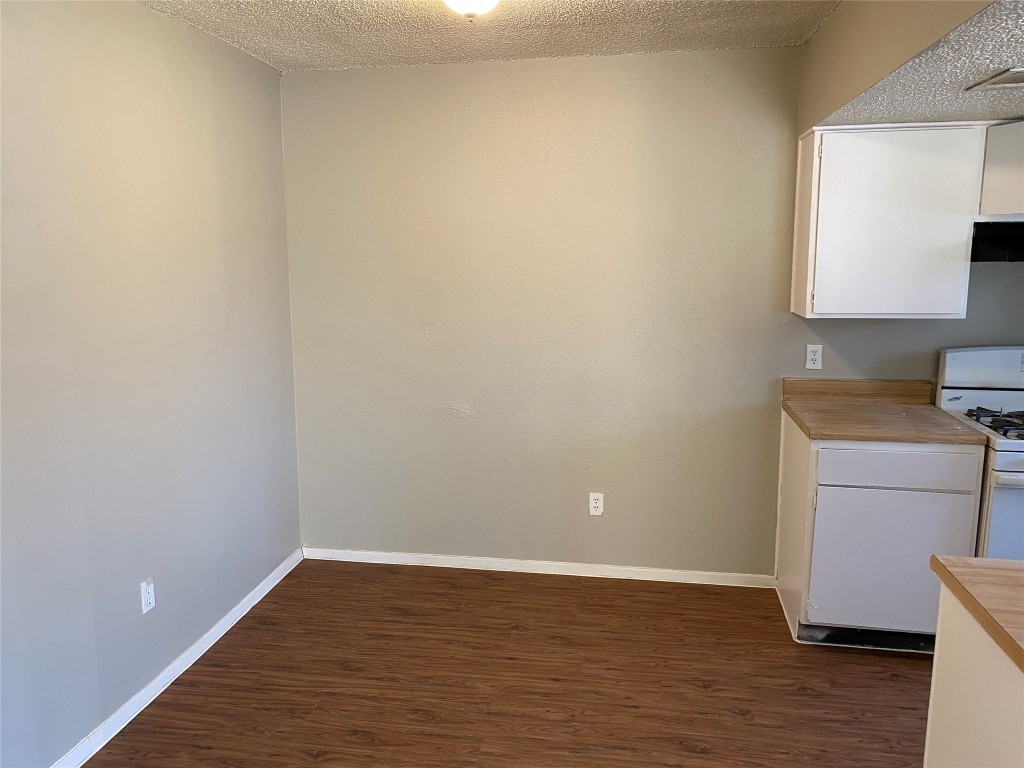 5202 Bogey Court, Unit A Austin, TX 78744 - Photo 5 of 15 a view of a room with wooden floor and a window