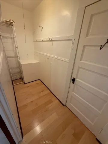 a view of livingroom with hardwood floor and hallway