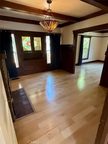 a view of kitchen with sink microwave refrigerator and wooden floor