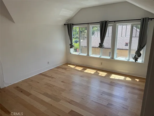 a view of an empty room with windows