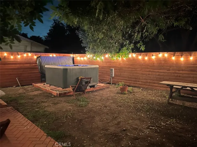 a view of a backyard of the house