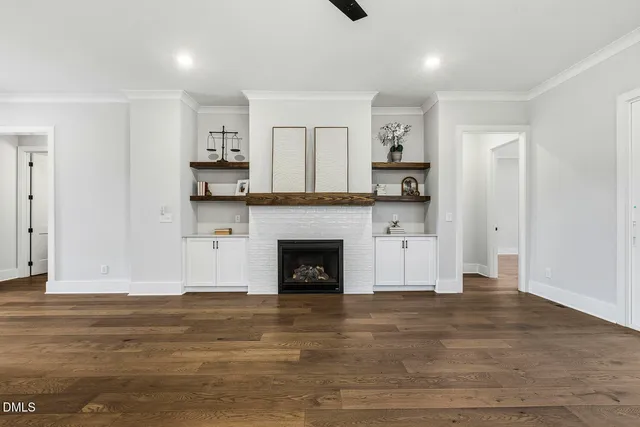 a bathroom with a double vanity sink a mirror and shower