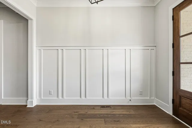 a kitchen with kitchen island granite countertop a sink cabinets and stainless steel appliances