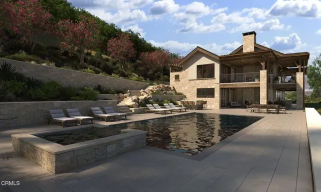 a view of swimming pool with outdoor seating and plants