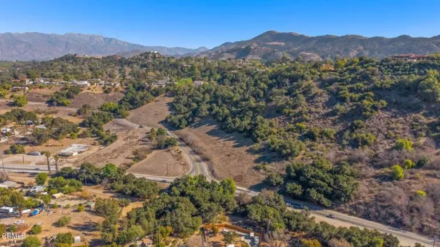 an aerial view of residential house and green space
