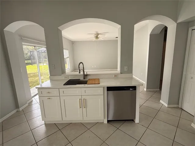 a kitchen with a sink and cabinets