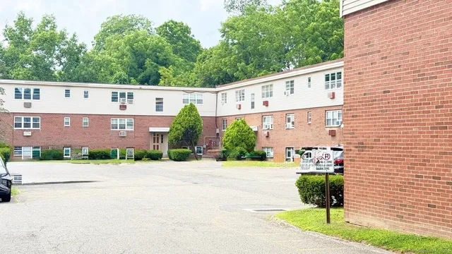 a front view of a building with garden