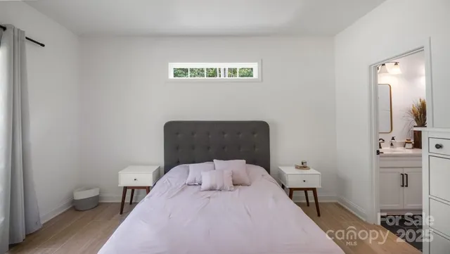 a bedroom with a dresser and a dresser