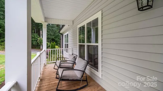 a view of balcony with furniture