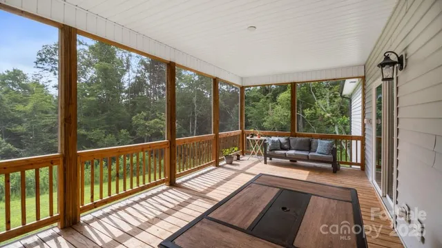 a view of a balcony with wooden floor