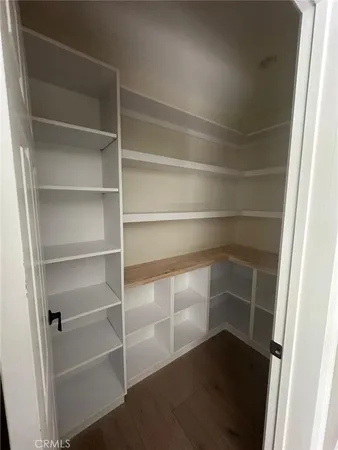 a living room with a toilet and a sink