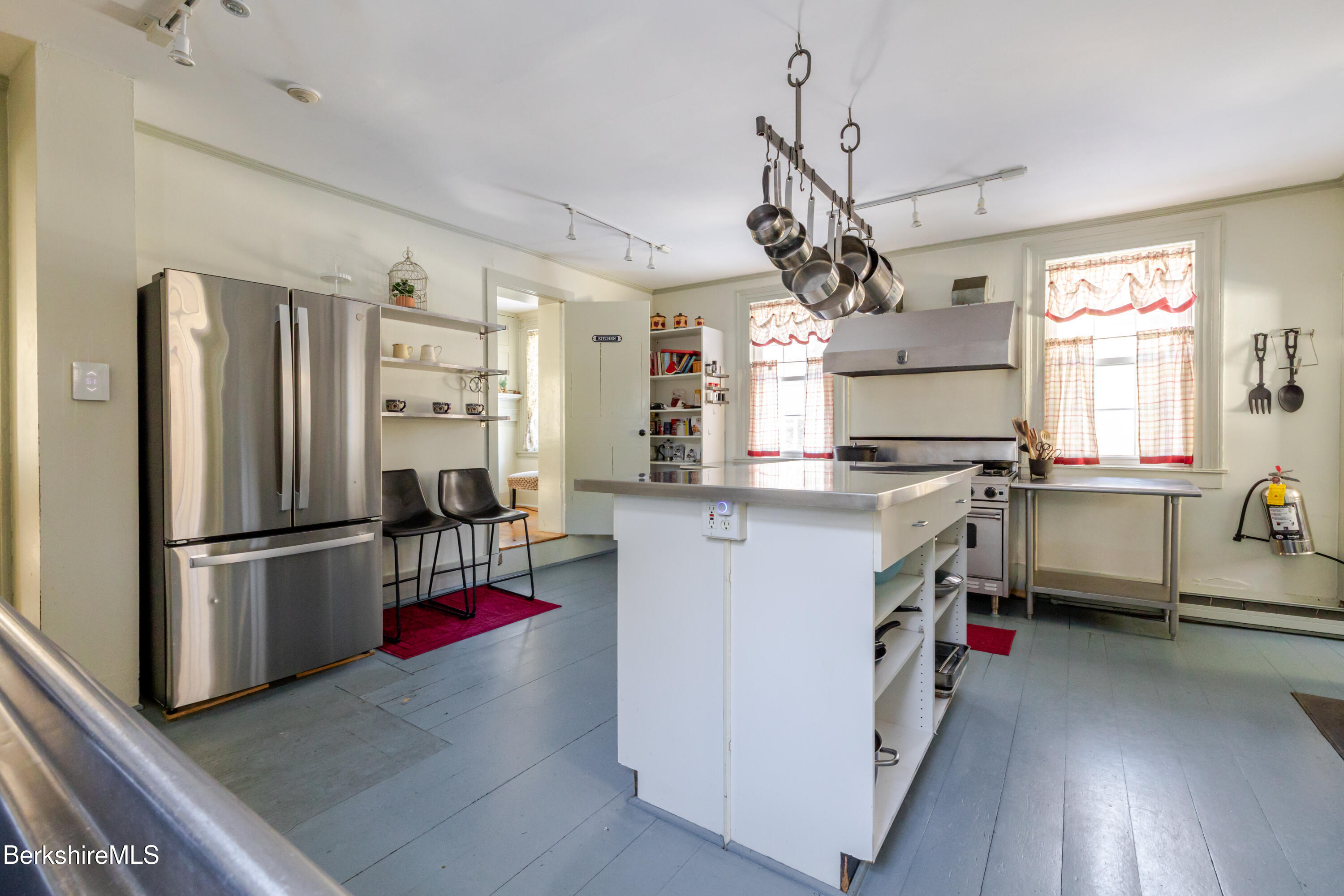3 Lake Buel Road Great Barrington, MA 01230 - Photo 7 of 55 a kitchen with stainless steel appliances granite countertop a refrigerator a stove a sink dishwasher a refrigerator and white cabinets with wooden floor