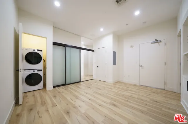 a view of a kitchen with a stove and a wooden floors