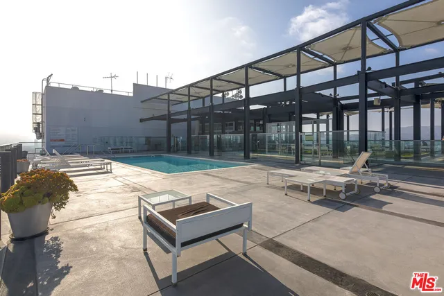 a patio with a table and chairs