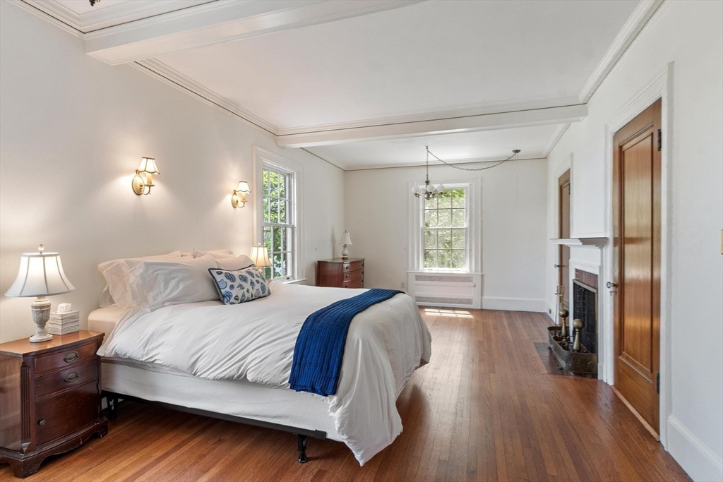 89 Lothrop Street Beverly, MA 01915 - Photo 28 of 41 a spacious bedroom with a bed and a window