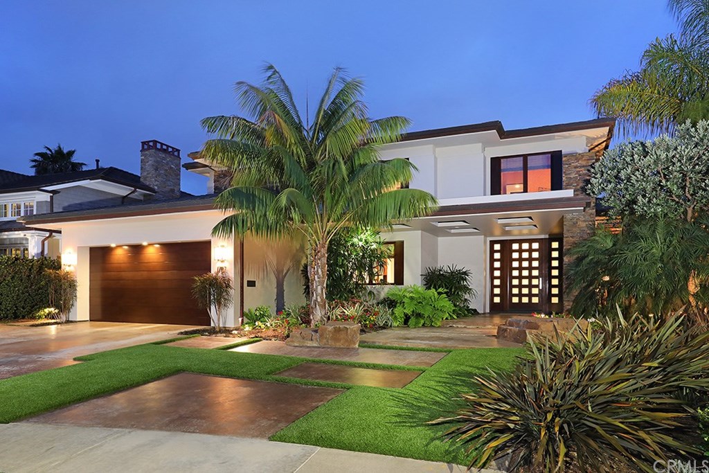 a front view of a house with a yard outdoor seating and entertaining space