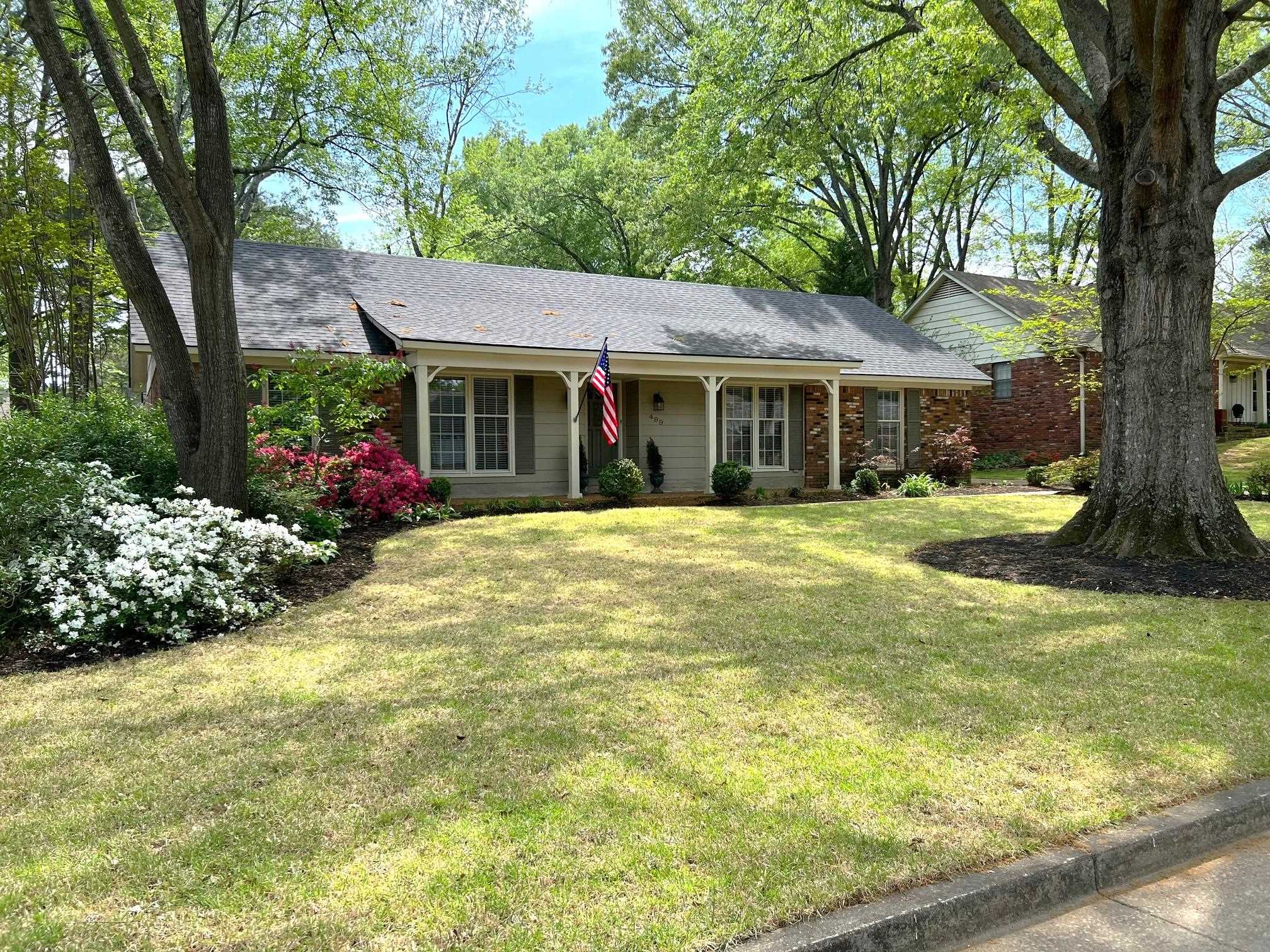 499 Rutledge Cove Collierville, TN 38017 - Photo 1 of 20 a view of a house with swimming pool next to a yard