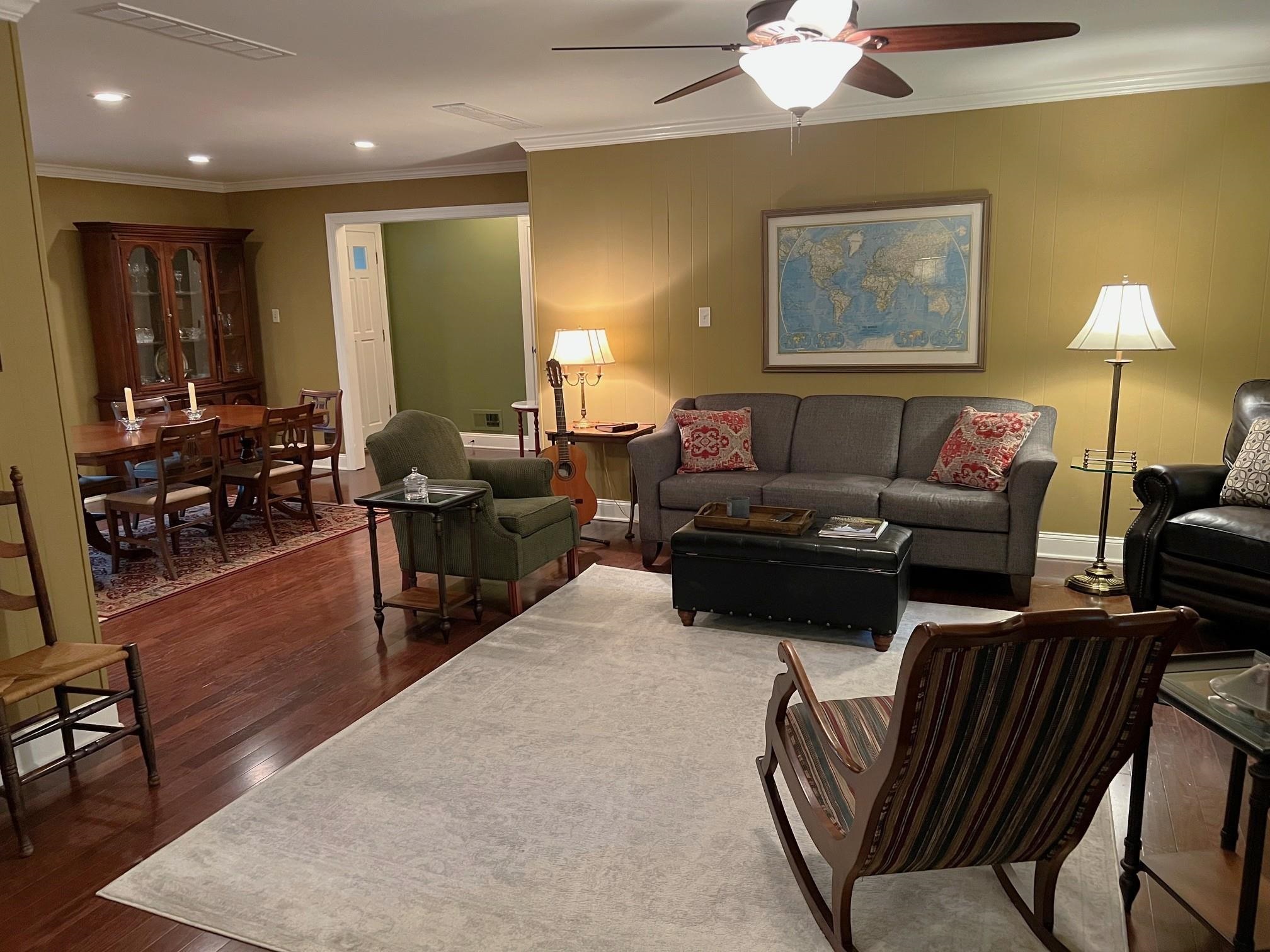 499 Rutledge Cove Collierville, TN 38017 - Photo 5 of 20 a living room with furniture a lamp and a chandelier