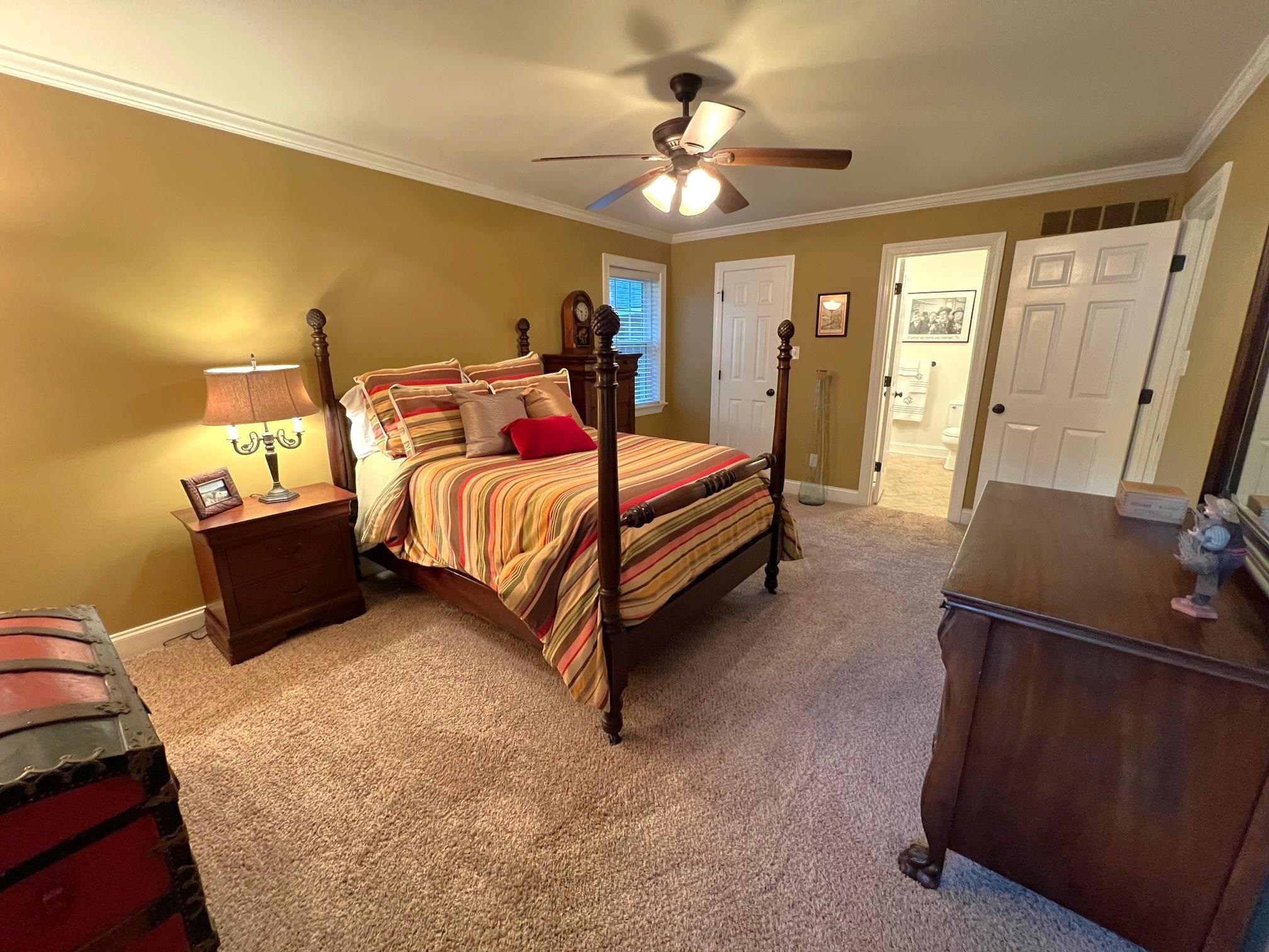 499 Rutledge Cove Collierville, TN 38017 - Photo 10 of 20 a bed room with a bed window and a dresser