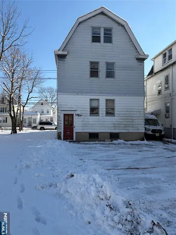 a view of garage yard and tree