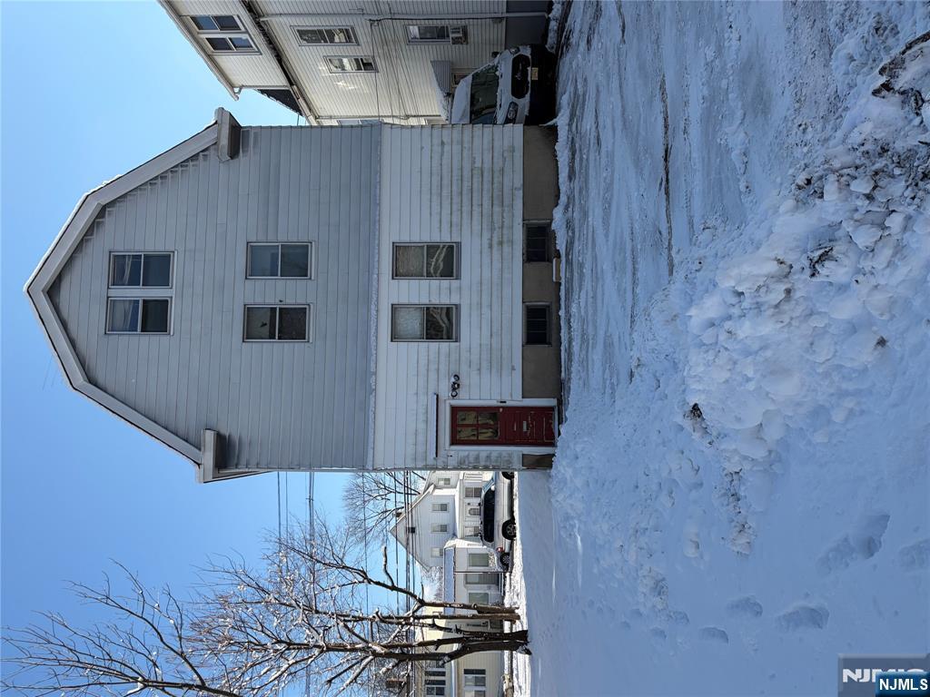 54 Broughton Avenue Bloomfield, NJ 07003 - Photo 3 of 4 a front view of a house with a yard