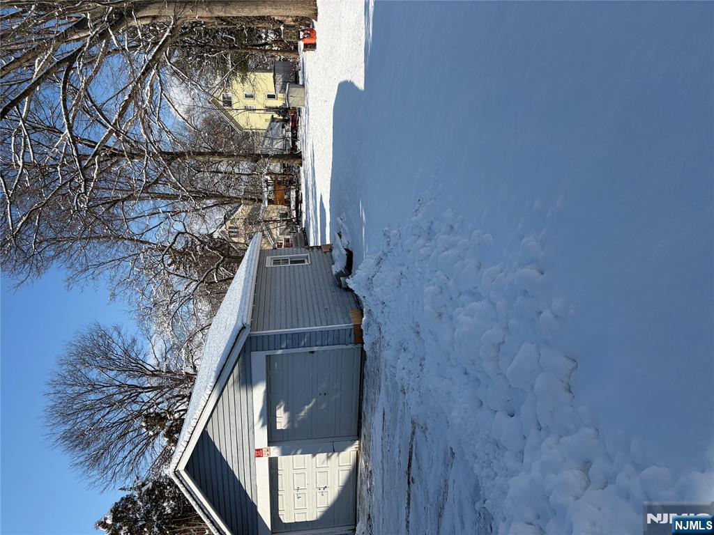 54 Broughton Avenue Bloomfield, NJ 07003 - Photo 4 of 4 a view of garage yard and tree