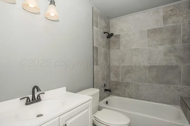 a bathroom with a sink toilet and bathtub