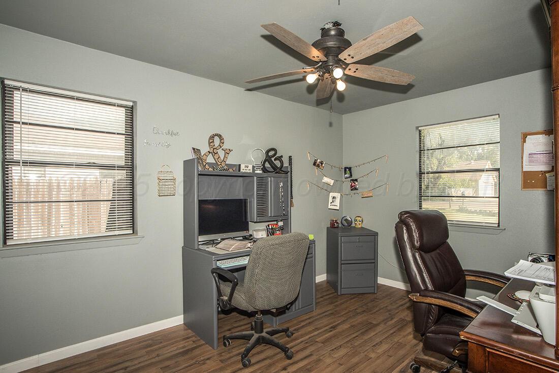 4206 Arden Road Amarillo, TX 79110 - Photo 19 of 26 a view of a workspace with furniture and a window