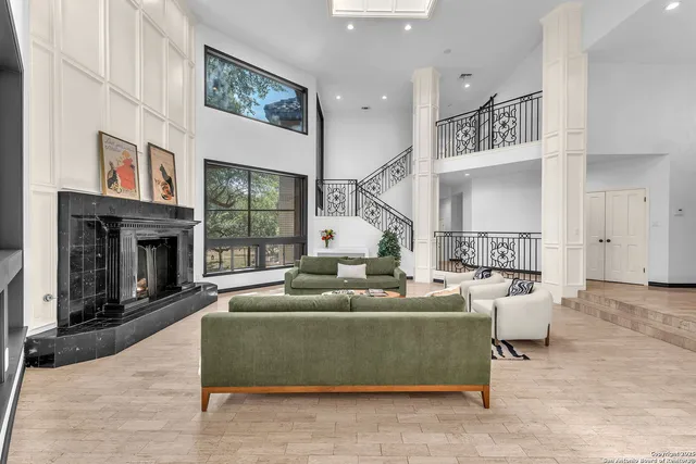 a kitchen with stainless steel appliances kitchen island granite countertop a stove and a sink