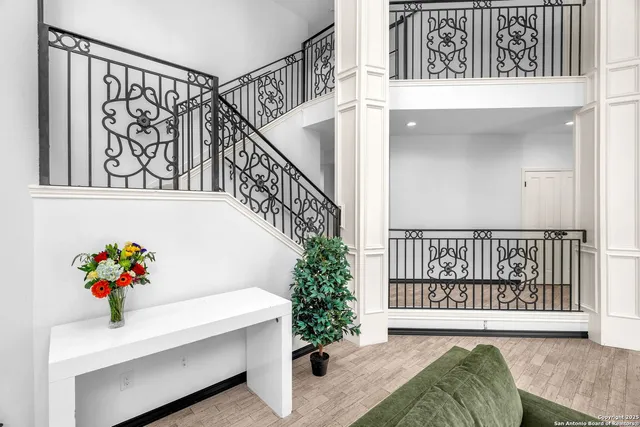 a kitchen with kitchen island granite countertop a sink cabinets and stainless steel appliances