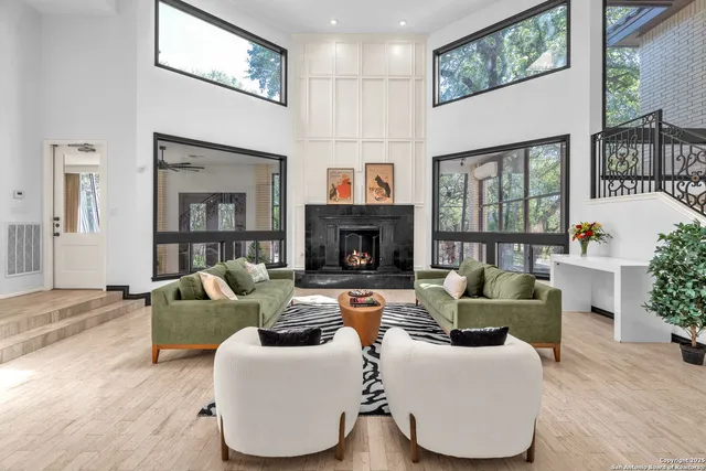 a kitchen with stainless steel appliances kitchen island granite countertop a stove a sink and a refrigerator