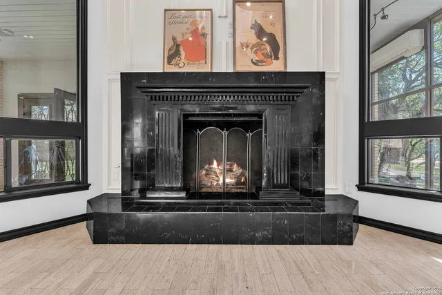 a kitchen with kitchen island a counter top a stove and a chandelier
