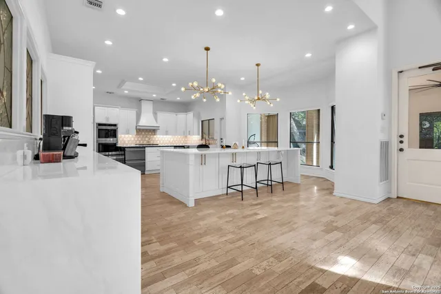 a view of a bedroom with a furniture and a window