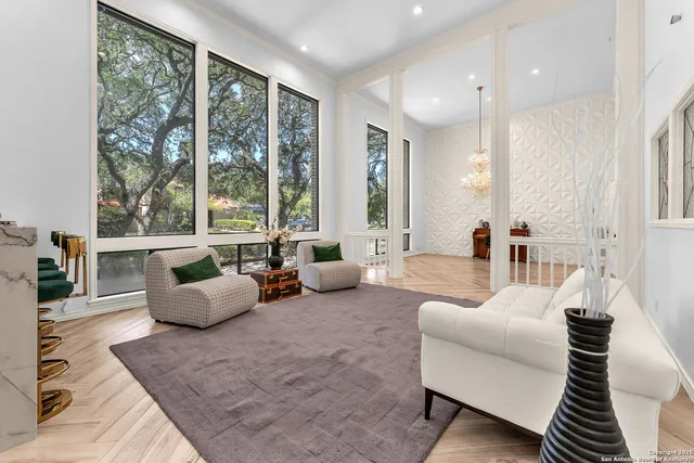 a bathroom with a sink a mirror a vanity and a shower
