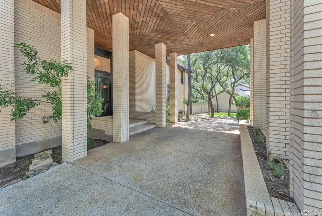 a view of a living room kitchen with furniture and a fireplace