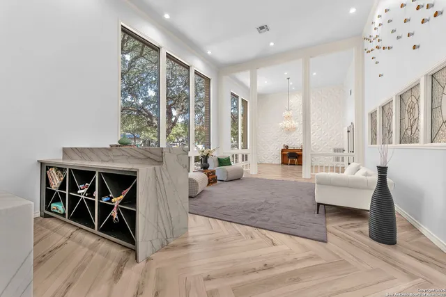 a view of a livingroom with a ceiling fan and window