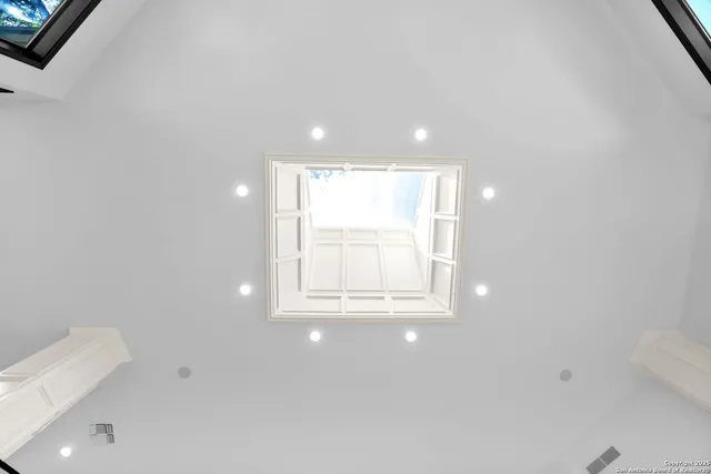 a view of a patio with couches table and chairs and potted plants